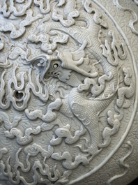 A Chinese white-glazed biscuit 'hu' vase with dragons, Qianlong mark, 19/20th C.
