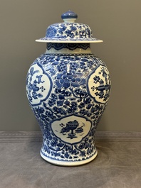A Chinese blue and white 'antiquities and peony scrolls' vase and cover, Kangxi