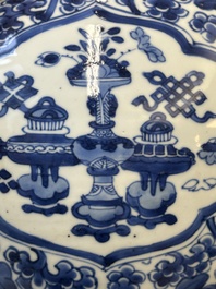 A Chinese blue and white 'antiquities and peony scrolls' vase and cover, Kangxi