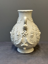 A Chinese white-glazed biscuit 'hu' vase with dragons, Qianlong mark, 19/20th C.