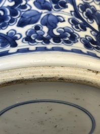A Chinese blue and white 'antiquities and peony scrolls' vase and cover, Kangxi