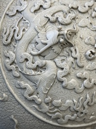 A Chinese white-glazed biscuit 'hu' vase with dragons, Qianlong mark, 19/20th C.