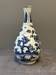 A Chinese blue and white 'birds among flowering branches' bottle vase, Ming