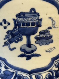 A Chinese blue and white 'antiquities and peony scrolls' vase and cover, Kangxi