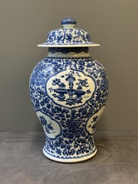A Chinese blue and white 'antiquities and peony scrolls' vase and cover, Kangxi