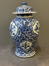 A Chinese blue and white 'antiquities and peony scrolls' vase and cover, Kangxi