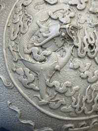 A Chinese white-glazed biscuit 'hu' vase with dragons, Qianlong mark, 19/20th C.