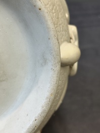 A Chinese white-glazed biscuit 'hu' vase with dragons, Qianlong mark, 19/20th C.