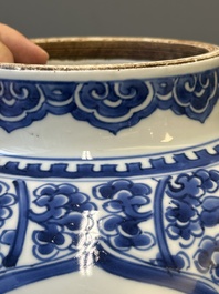 A Chinese blue and white 'antiquities and peony scrolls' vase and cover, Kangxi