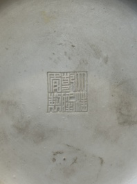 A Chinese white-glazed biscuit 'hu' vase with dragons, Qianlong mark, 19/20th C.