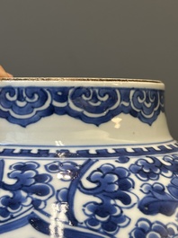 A Chinese blue and white 'antiquities and peony scrolls' vase and cover, Kangxi