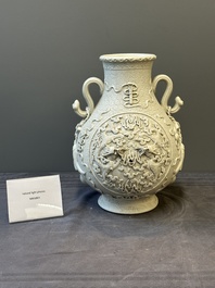 A Chinese white-glazed biscuit 'hu' vase with dragons, Qianlong mark, 19/20th C.