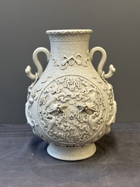 A Chinese white-glazed biscuit 'hu' vase with dragons, Qianlong mark, 19/20th C.
