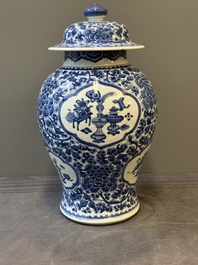 A Chinese blue and white 'antiquities and peony scrolls' vase and cover, Kangxi