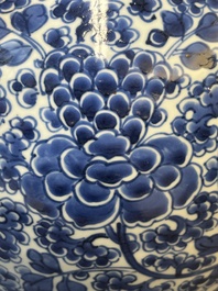 A Chinese blue and white 'antiquities and peony scrolls' vase and cover, Kangxi