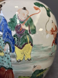 A Chinese famille rose 'ladies and boys' jar with wooden cover and stand, Yongzheng/Qianlong