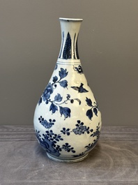 A Chinese blue and white 'birds among flowering branches' bottle vase, Ming