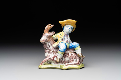 A polychrome Dutch Delft butter tub and cover in the shape of a buckrider, 18th C.