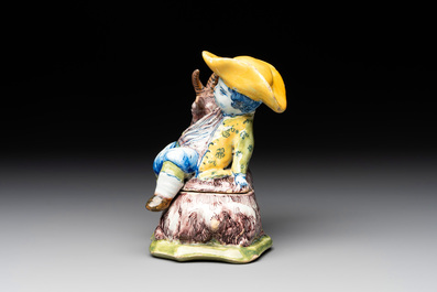 A polychrome Dutch Delft butter tub and cover in the shape of a buckrider, 18th C.