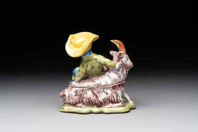 A polychrome Dutch Delft butter tub and cover in the shape of a buckrider, 18th C.