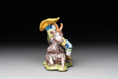 A polychrome Dutch Delft butter tub and cover in the shape of a buckrider, 18th C.