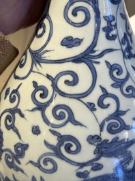 A Chinese blue and white 'phoenix and flower scroll' bottle vase, Ming