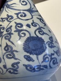 A Chinese blue and white 'phoenix and flower scroll' bottle vase, Ming