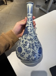 A Chinese blue and white 'phoenix and flower scroll' bottle vase, Ming