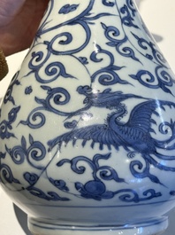 A Chinese blue and white 'phoenix and flower scroll' bottle vase, Ming