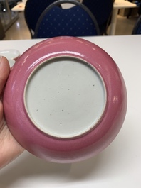 Three Chinese ruby-ground famille rose plates and a cup, 19th C.