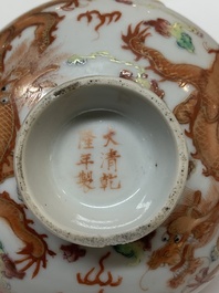 Two famille rose 'dragon' bowls and covers and a plate, Qianlong and Guangxu marks, 19/20th C.