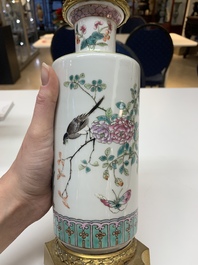 A pair of Chinese famille rose gilt-bronze-mounted 'birds among flowering branches' vases, 19th C.