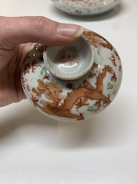 Two famille rose 'dragon' bowls and covers and a plate, Qianlong and Guangxu marks, 19/20th C.