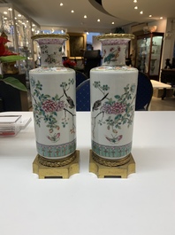 A pair of Chinese famille rose gilt-bronze-mounted 'birds among flowering branches' vases, 19th C.