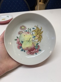 Three Chinese ruby-ground famille rose plates and a cup, 19th C.