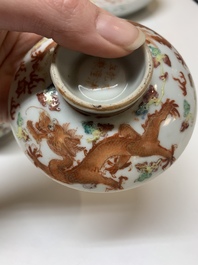 Two famille rose 'dragon' bowls and covers and a plate, Qianlong and Guangxu marks, 19/20th C.