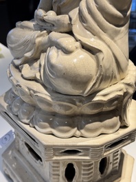 An extremely rare Chinese Swatow cream-glazed seated Buddha, Xuande mark, Ming