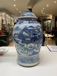 A near pair of Chinese blue and white 'landscape' vases and covers, 19th C.