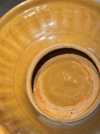 A Chinese incised brown-glazed Longquan dish with floral design, Ming