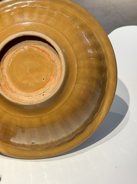 A Chinese incised brown-glazed Longquan dish with floral design, Ming