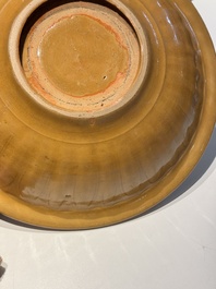 A Chinese incised brown-glazed Longquan dish with floral design, Ming