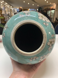 A pair of fine Chinese famille verte turquoise-ground 'magpie and prunus' jars with reticulated wooden covers, 19th C.