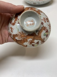 Two famille rose 'dragon' bowls and covers and a plate, Qianlong and Guangxu marks, 19/20th C.
