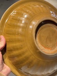 A Chinese incised brown-glazed Longquan dish with floral design, Ming