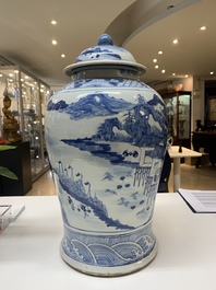 A near pair of Chinese blue and white 'landscape' vases and covers, 19th C.