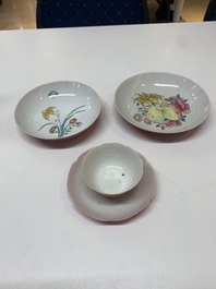 Three Chinese ruby-ground famille rose plates and a cup, 19th C.