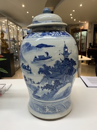 A near pair of Chinese blue and white 'landscape' vases and covers, 19th C.