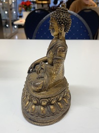A fine Sino-Tibetan gilt bronze Buddha, 15/16th C.
