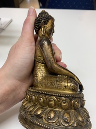 A fine Sino-Tibetan gilt bronze Buddha, 15/16th C.