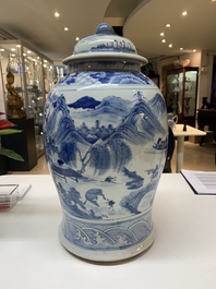 A near pair of Chinese blue and white 'landscape' vases and covers, 19th C.